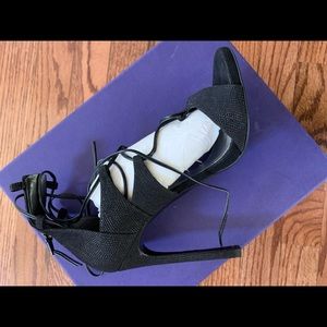 woman’s Stuart Weitzman heels